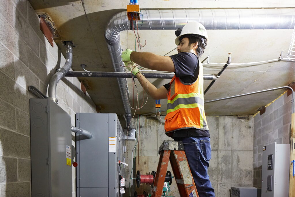 Electrician career outlook remains strong for this Prairie Electric technician working on key building facilities on a commercial electrical project.