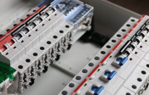 Close-up of an electrical circuit breaker panel with multiple switches and wiring components, expertly installed by a skilled electrician in Vancouver, WA.